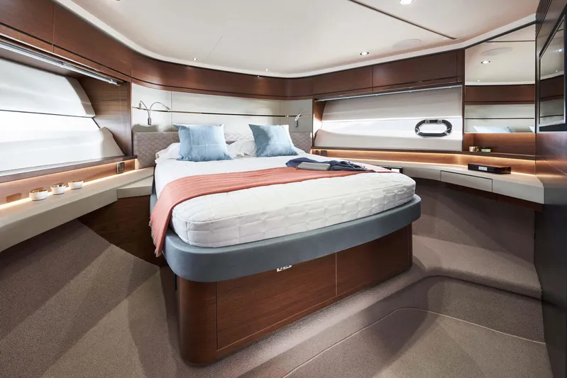  Yacht Photos Pics Luxurious bedroom interior of 2025 Princess S65 yacht with modern design and elegant furnishings.