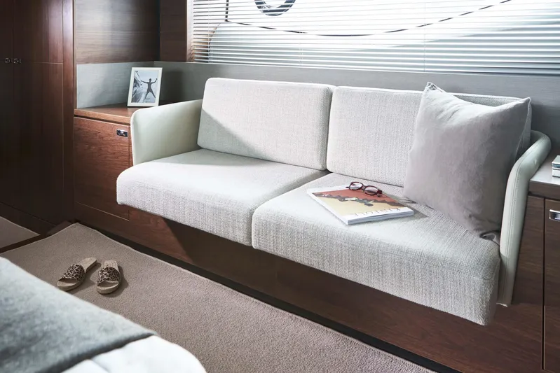  Yacht Photos Pics Luxurious interior of 2025 Princess S65 yacht with elegant sofa and decor.