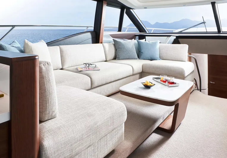  Yacht Photos Pics Luxurious interior of 2025 Princess S65 yacht with elegant seating and ocean view.