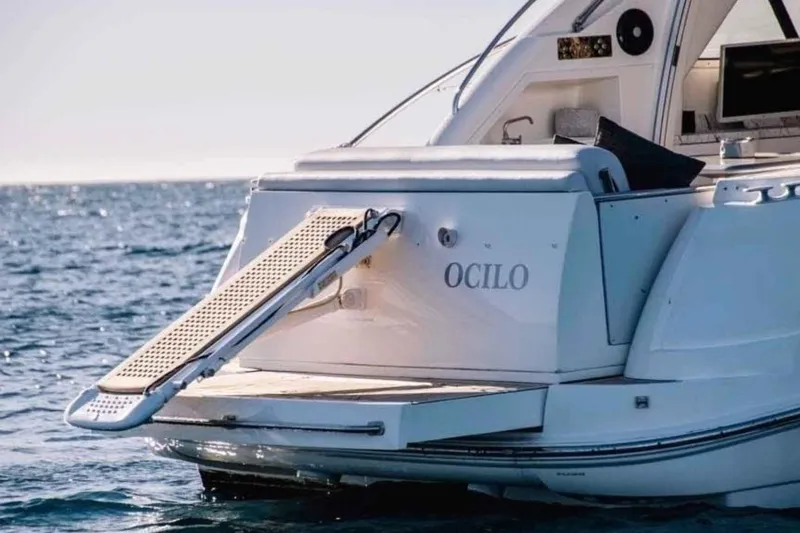 Ocilo Yacht Photos Pics 2005 Sealine SC 39 yacht with extended swim platform on open water.