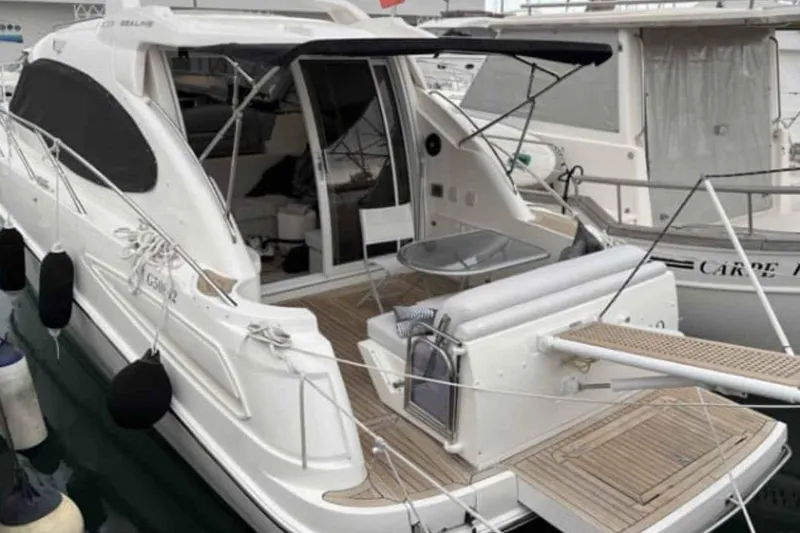 Ocilo Yacht Photos Pics 2005 Sealine SC 39 yacht docked, featuring spacious deck and modern design.