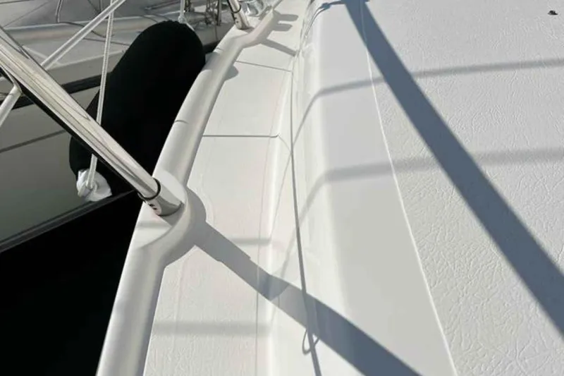 Ocilo Yacht Photos Pics 2005 Sealine SC 39 yacht deck with railing and shadows.