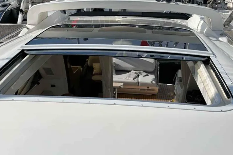 Ocilo Yacht Photos Pics 2005 Sealine SC 39 yacht with open sunroof, showcasing interior seating area.