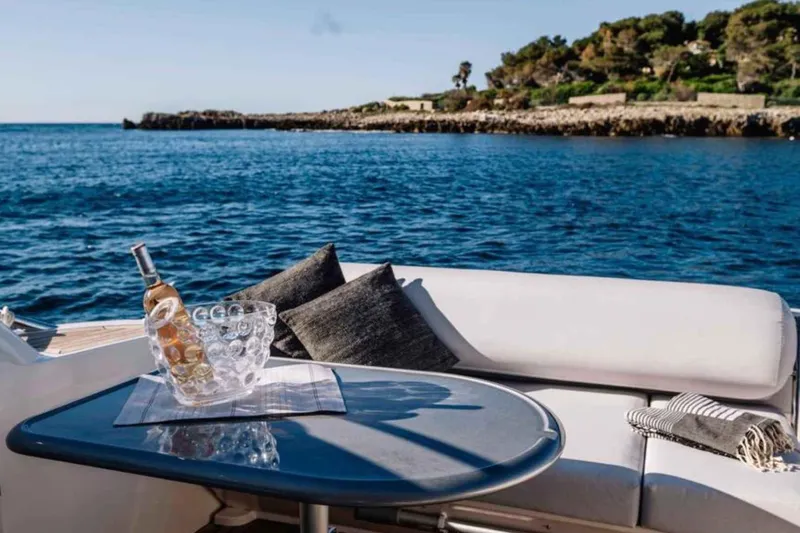 Ocilo Yacht Photos Pics Luxury Sealine SC 39 yacht interior with ocean view, wine, and cushions, 2005 model.