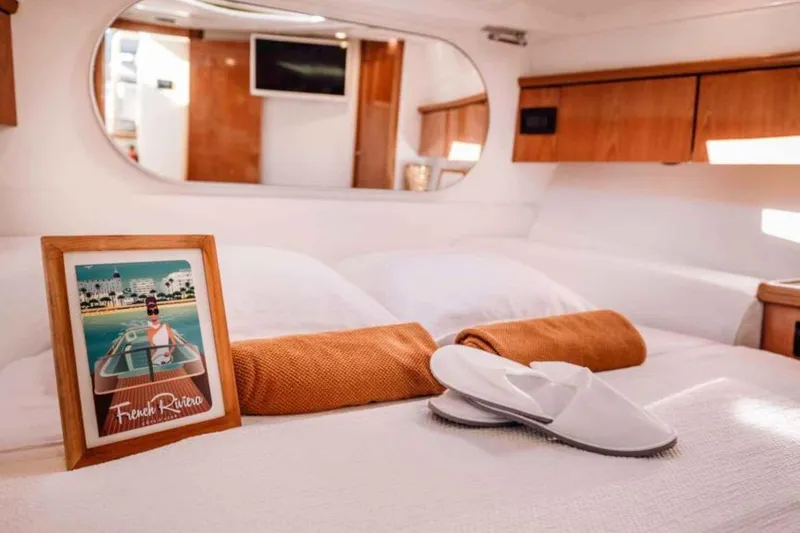 Ocilo Yacht Photos Pics Luxurious cabin interior of 2005 Sealine SC 39 yacht with cozy bedding and decor.