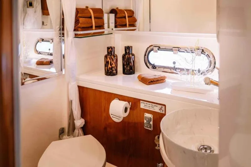 Ocilo Yacht Photos Pics Luxurious bathroom in 2005 Sealine SC 39 yacht with elegant decor and modern amenities.