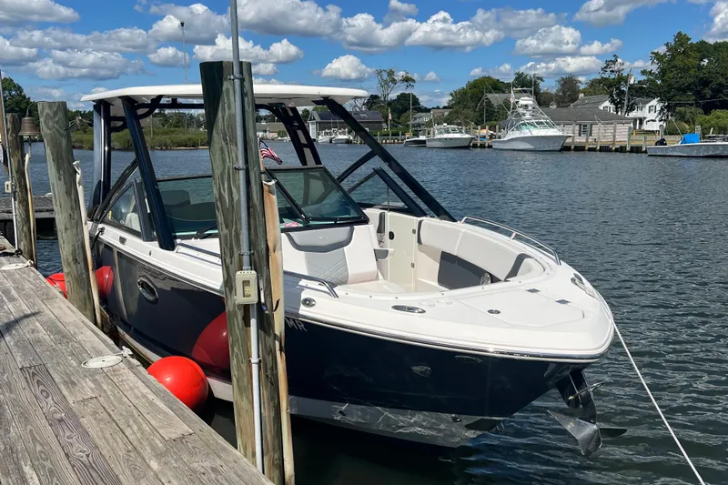  Yacht Photos Pics 2020 Chaparral 280 OSX boat docked on a sunny day with blue skies.
