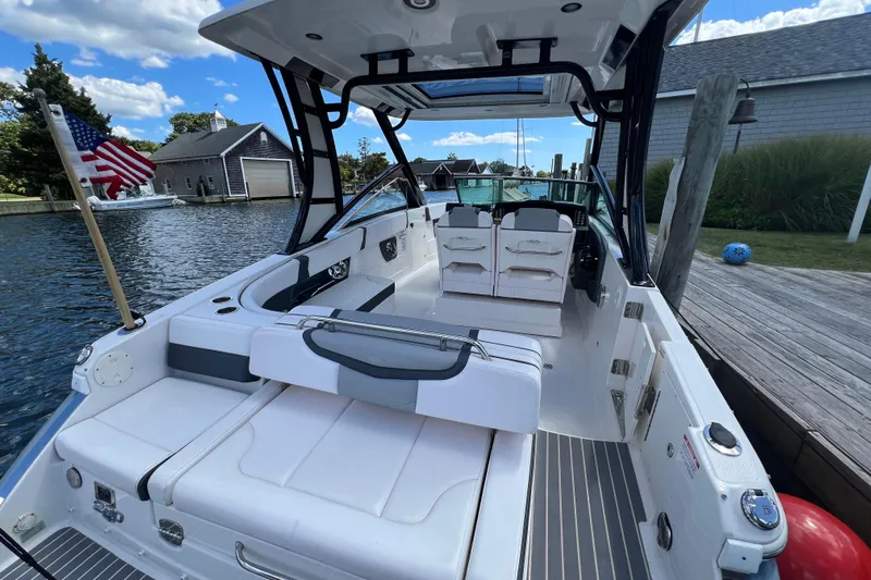  Yacht Photos Pics 2020 Chaparral 280 OSX boat docked, featuring spacious seating and sleek design.