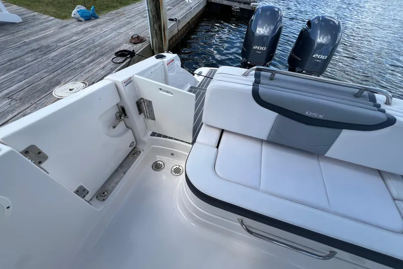  Yacht Photos Pics 2020 Chaparral 280 OSX boat interior with seating and twin engines by the dock.