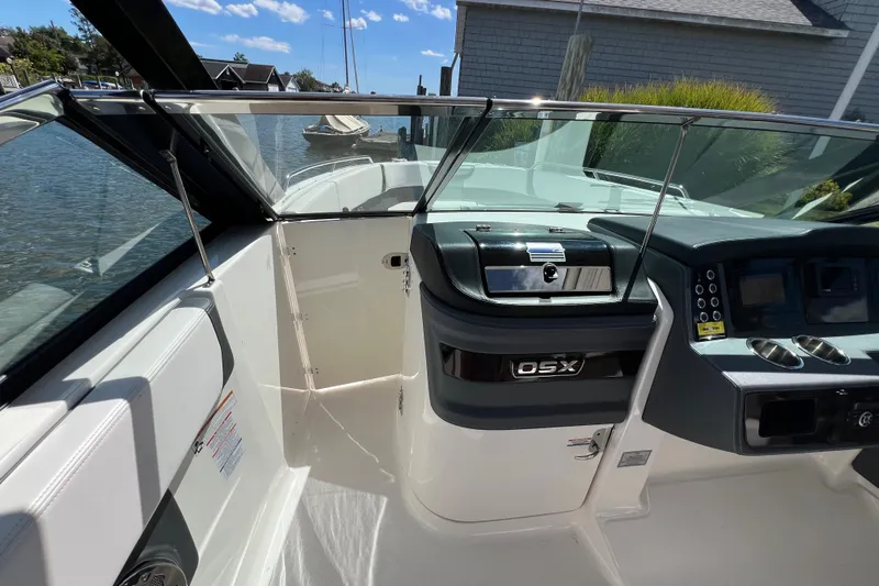  Yacht Photos Pics 2020 Chaparral 280 OSX boat interior with sleek dashboard and waterfront view.