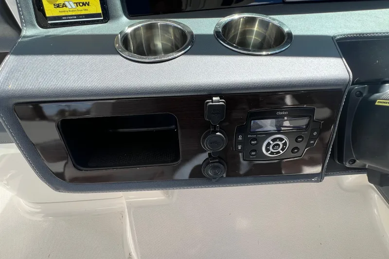  Yacht Photos Pics Dashboard of 2020 Chaparral 280 OSX with audio system and cup holders.