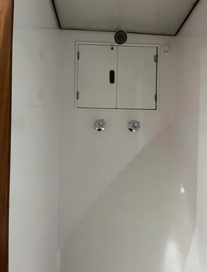  Yacht Photos Pics Interior of 1985 Hines-Farley Custom Express yacht with white panel and controls.