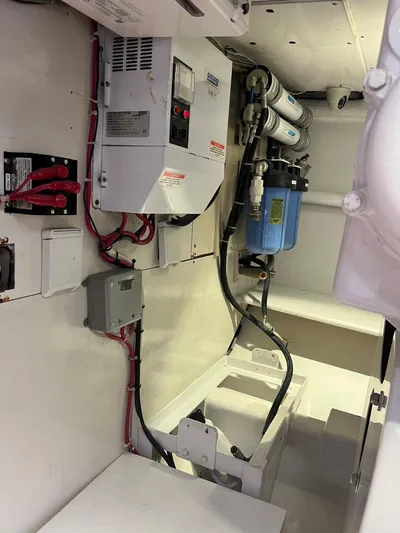  Yacht Photos Pics 1985 Hines-Farley Custom Express engine room with electrical and filtration systems.