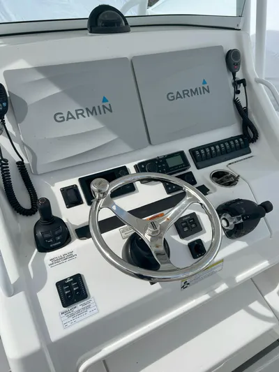 Angler Management Yacht Photos Pics 2013 Regulator 34 Center Console helm with Garmin navigation system and controls.