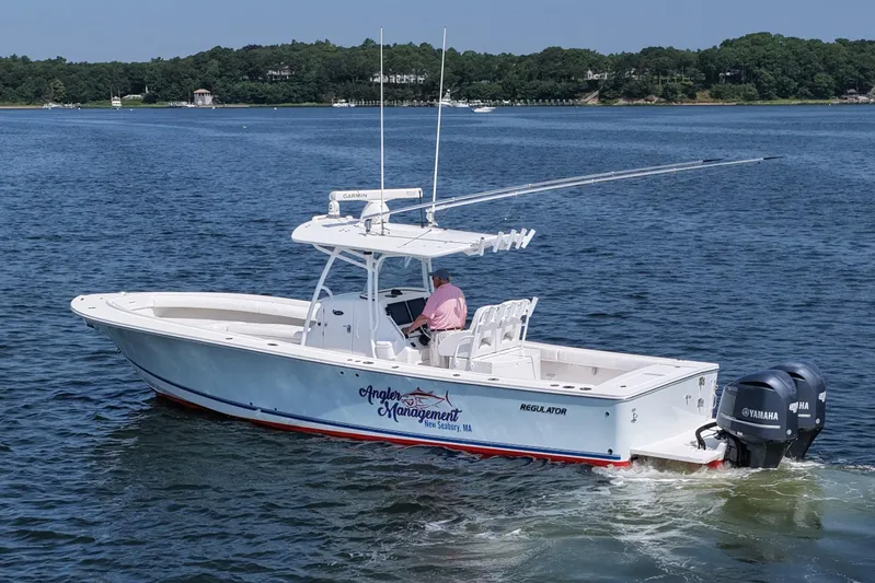 Angler Management Yacht Photos Pics 2013 Regulator 34 Center Console boat on water, featuring dual Yamaha engines.