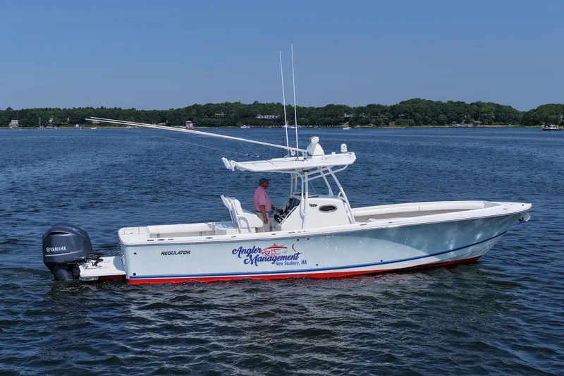 Angler Management Yacht Photos Pics 2013 Regulator 34 Center Console boat on calm water with Yamaha engine.