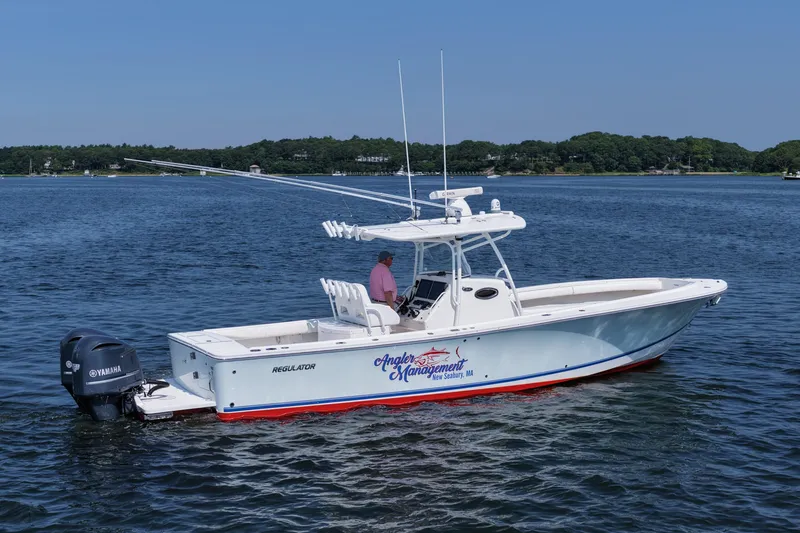 Angler Management Yacht Photos Pics 2013 Regulator 34 Center Console boat on water, featuring Yamaha engines.