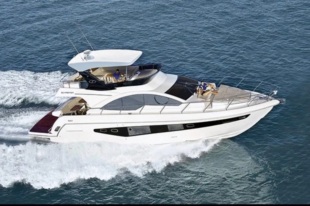 Luxury Schaefer 56 yacht cruising on open water, 2017 model.