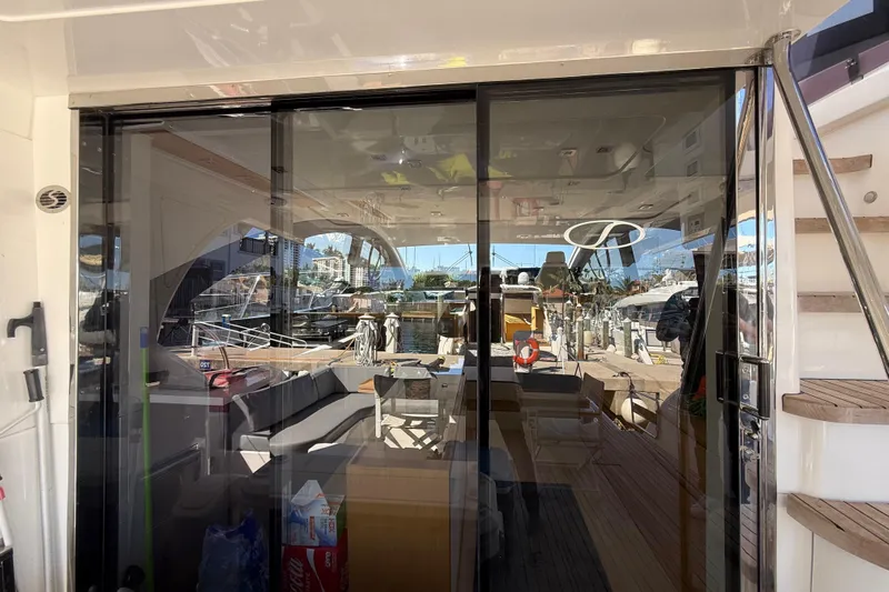  Yacht Photos Pics Luxurious 2017 Schaefer 56 yacht interior with glass doors and marina view.