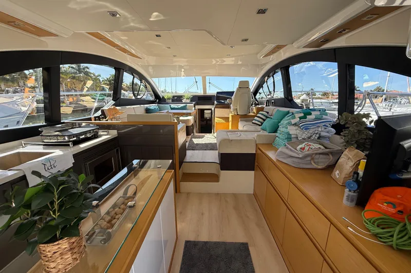  Yacht Photos Pics Luxurious interior of 2017 Schaefer 56 yacht with modern furnishings and panoramic windows.