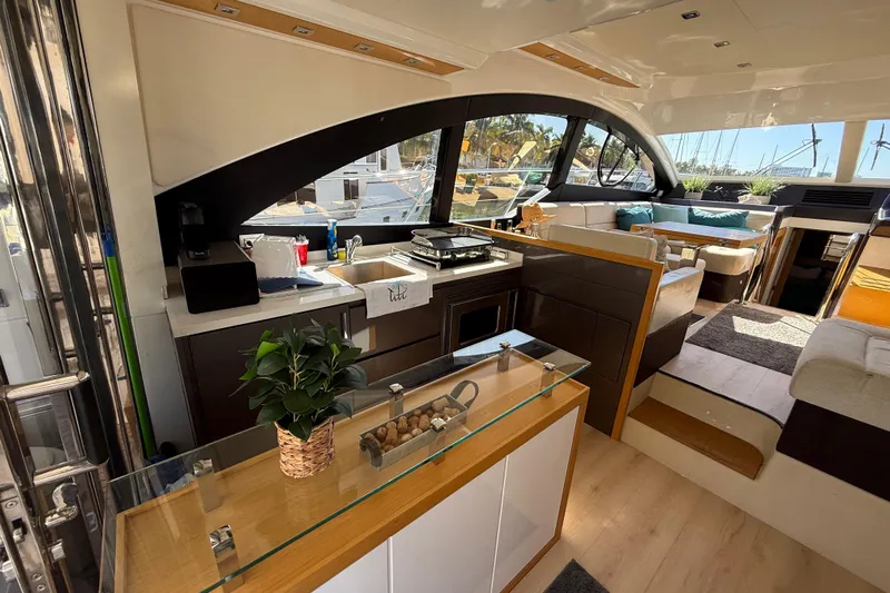  Yacht Photos Pics Luxurious interior of 2017 Schaefer 56 yacht with modern kitchen and seating area.