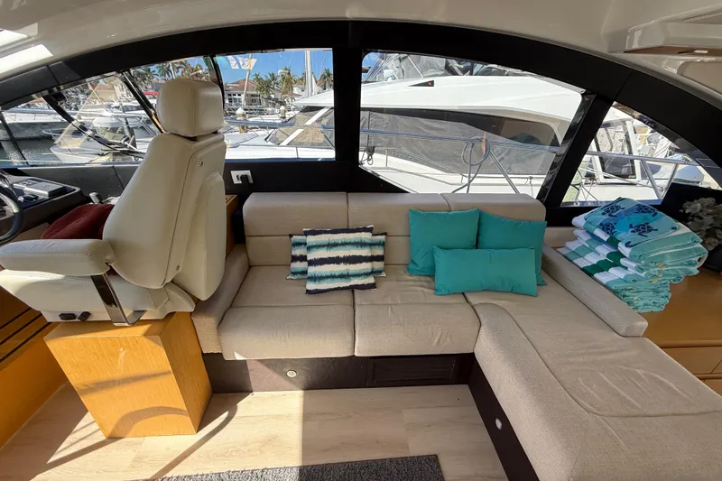  Yacht Photos Pics Luxurious interior of 2017 Schaefer 56 yacht with plush seating and vibrant cushions.