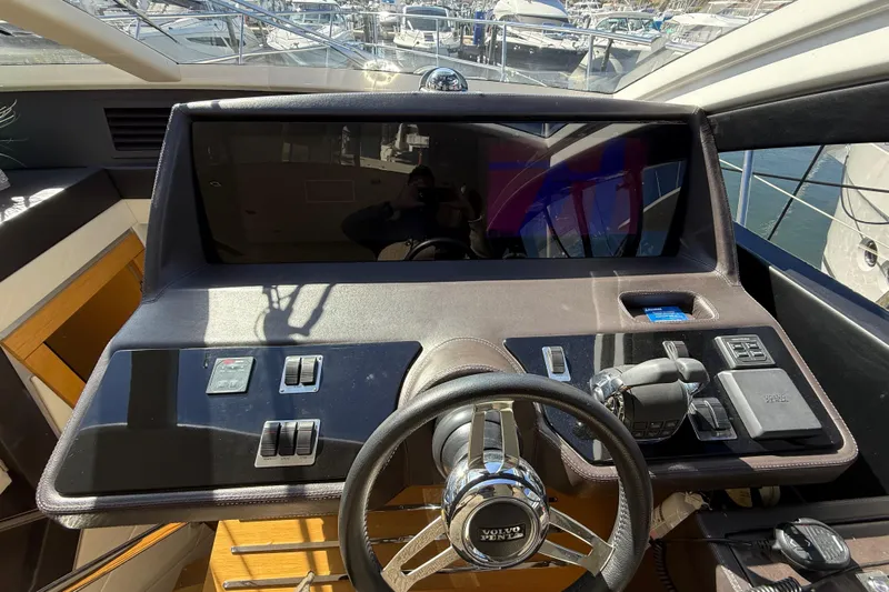  Yacht Photos Pics Helm of 2017 Schaefer 56 yacht with modern controls and steering wheel.