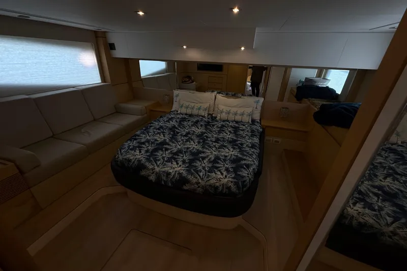  Yacht Photos Pics Luxurious cabin interior of 2017 Schaefer 56 yacht with elegant bedding and seating.