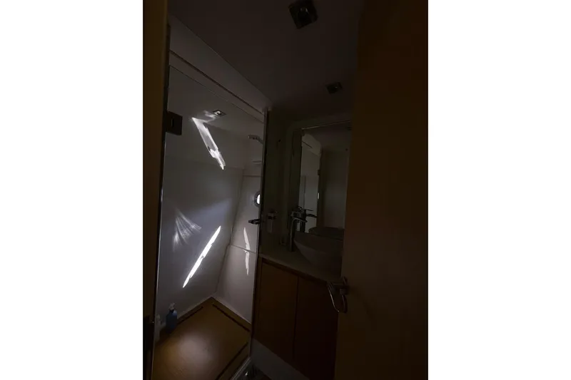  Yacht Photos Pics Interior of 2017 Schaefer 56 yacht bathroom with modern fixtures and lighting.