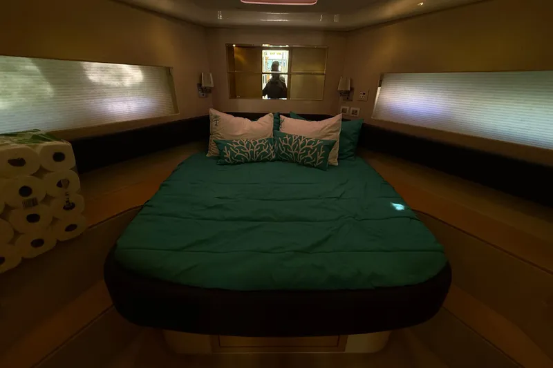  Yacht Photos Pics Luxurious bedroom interior of 2017 Schaefer 56 yacht with teal bedding and modern design.