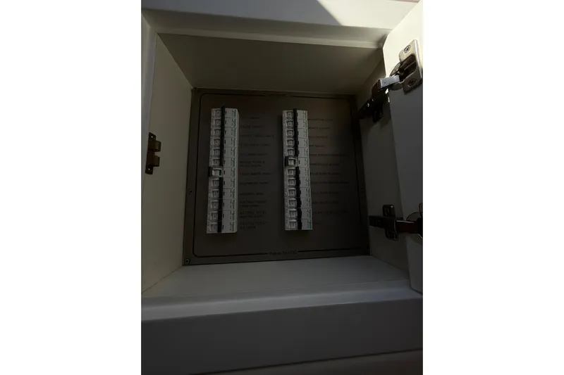  Yacht Photos Pics Electrical panel inside Schaefer 56 yacht, 2017 model, with labeled switches.