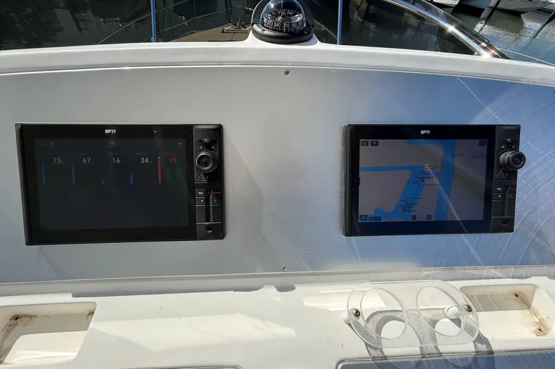  Yacht Photos Pics Control panel of a 2017 Schaefer 56 yacht with navigation screens.