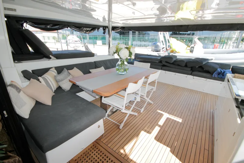  Yacht Photos Pics Luxurious 2019 Lagoon 620 Essense yacht interior with elegant seating and dining area.