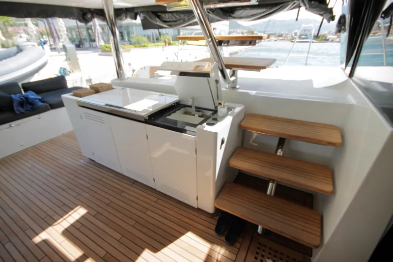  Yacht Photos Pics Luxurious 2019 Lagoon 620 Essense yacht interior with wooden flooring and modern amenities.