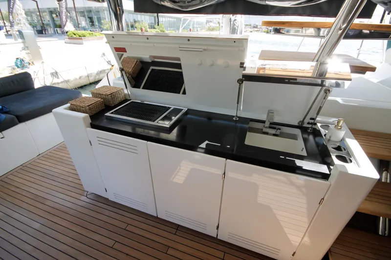  Yacht Photos Pics Outdoor kitchen on 2019 Lagoon 620 Essense yacht with grill and sink.
