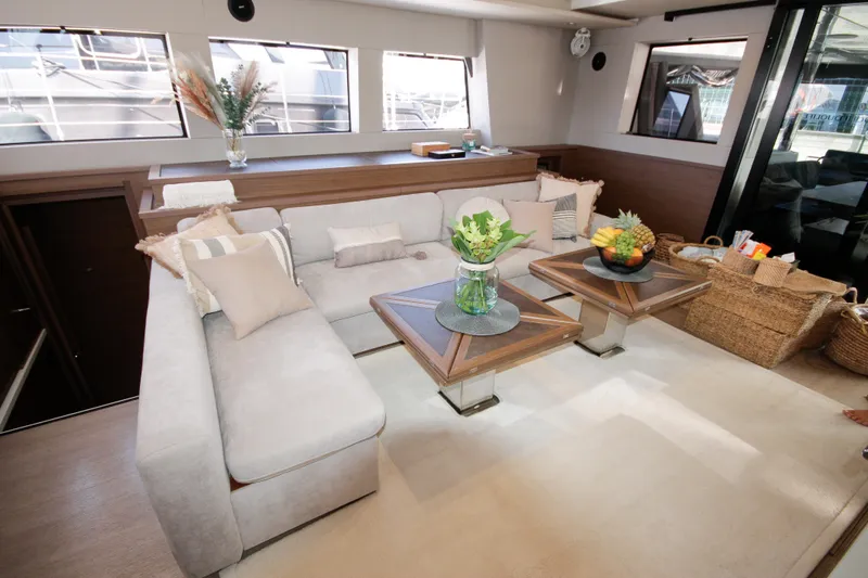  Yacht Photos Pics Luxurious interior of 2019 Lagoon 620 Essense yacht with elegant seating and decor.