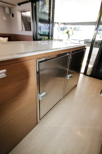  Yacht Photos Pics Modern kitchen area on 2019 Lagoon 620 Essense yacht with stainless steel appliances.