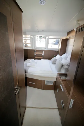  Yacht Photos Pics Luxurious cabin interior of 2019 Lagoon 620 Essense yacht with cozy bed and modern design.