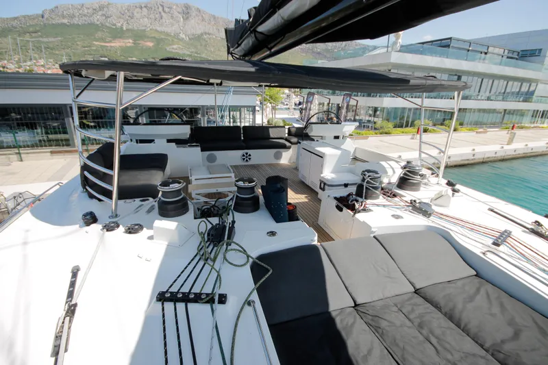  Yacht Photos Pics Luxurious 2019 Lagoon 620 Essense yacht deck with modern seating and equipment.