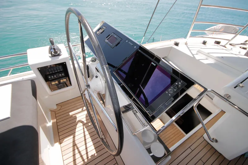  Yacht Photos Pics Helm of 2019 Lagoon 620 Essense yacht with modern navigation equipment.