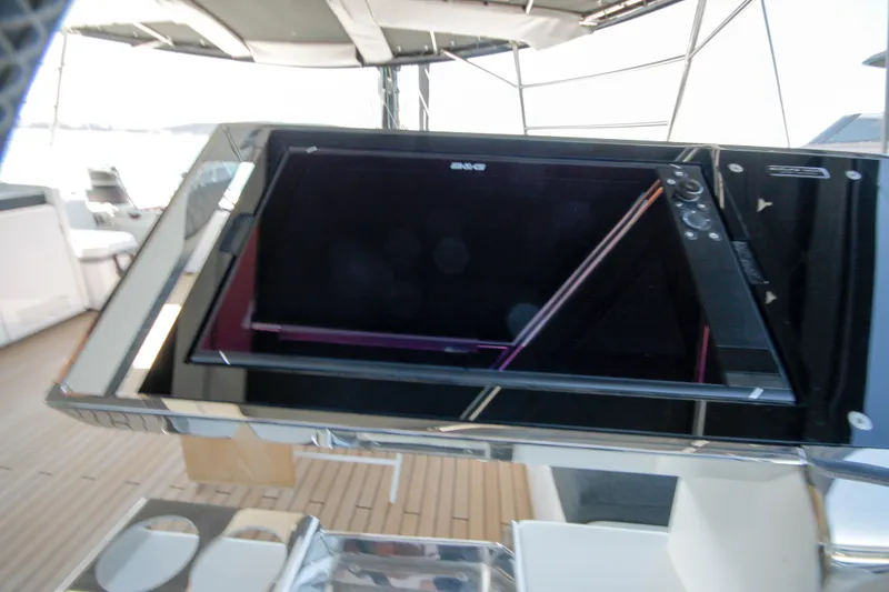  Yacht Photos Pics Control panel on 2019 Lagoon 620 Essense yacht, featuring modern navigation equipment.