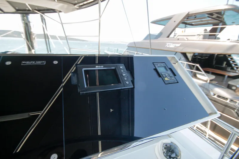  Yacht Photos Pics Control panel of 2019 Lagoon 620 Essense yacht with navigation equipment.