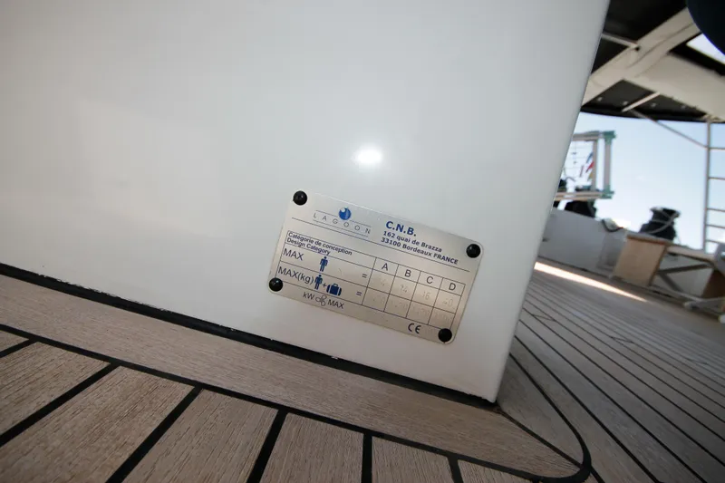  Yacht Photos Pics 2019 Lagoon 620 Essense yacht deck with design category plaque.