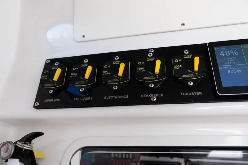 Toto II Yacht Photos Pics Control panel of a 2019 Mag Bay 33 CC boat with battery status display.