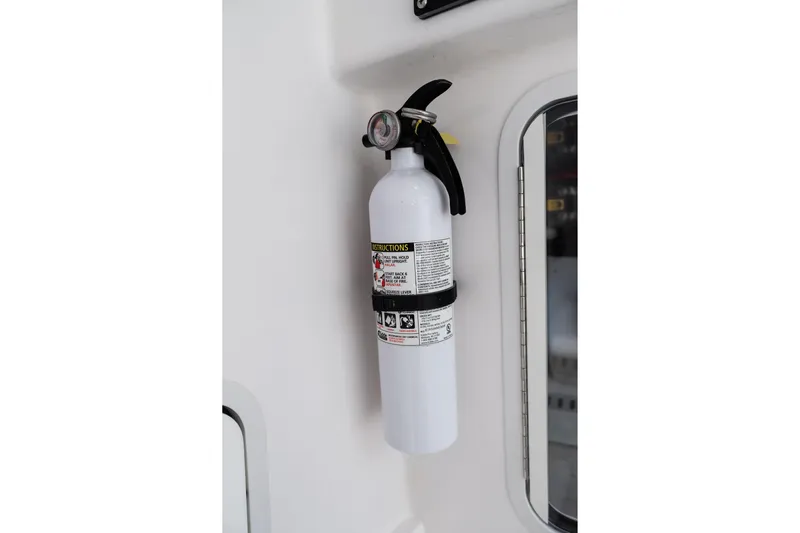 Toto II Yacht Photos Pics Fire extinguisher mounted on 2019 Mag Bay 33 CC boat interior.