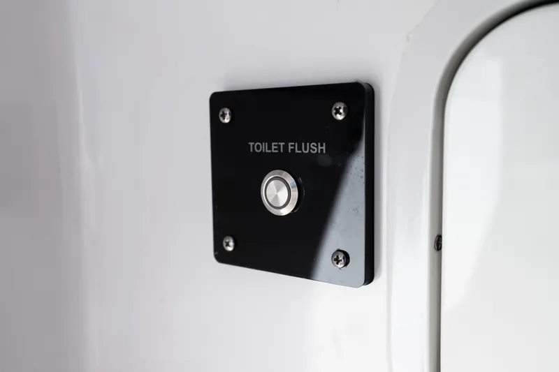 Toto II Yacht Photos Pics Toilet flush button on 2019 Mag Bay 33 CC boat interior.