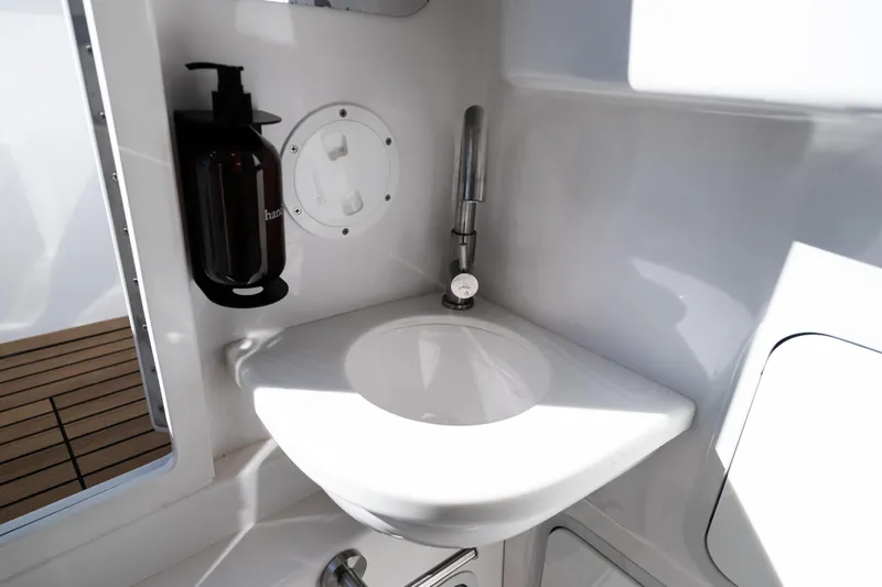 Toto II Yacht Photos Pics 2019 Mag Bay 33 CC boat interior with sink and soap dispenser.