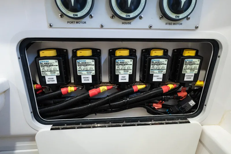Toto II Yacht Photos Pics Electrical panel of 2019 Mag Bay 33 CC boat with labeled switches and wiring.