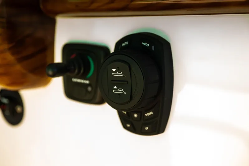 Toto II Yacht Photos Pics Control panel of 2019 Mag Bay 33 CC boat, featuring navigation buttons.