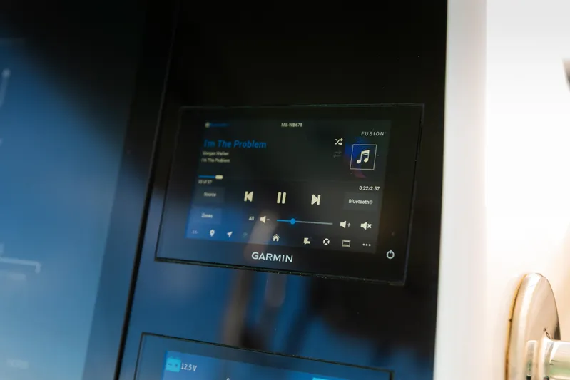 Toto II Yacht Photos Pics Garmin display on 2019 Mag Bay 33 CC boat showing music controls.